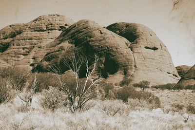 Rock formation on land against sky