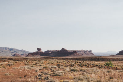 Scenic view of arid landscape against clear sky