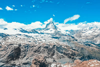 Scenic view of snowcapped mountains against sky