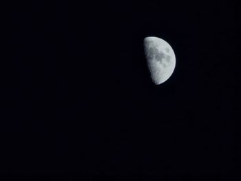 Low angle view of moon against clear sky at night