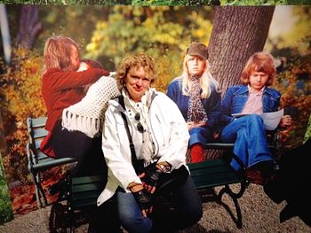 Portrait of cute boy sitting on table