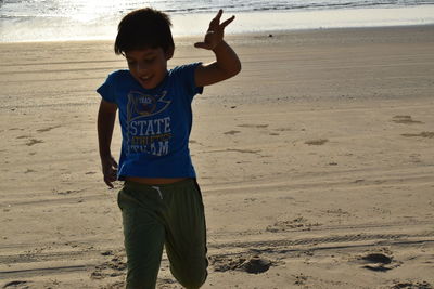 Full length of boy on beach