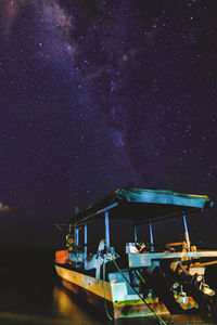 Boats moored at night