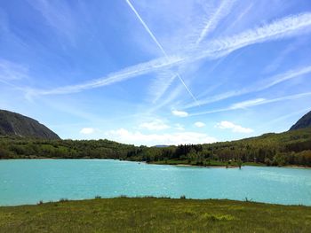 Scenic view of lake against blue sky