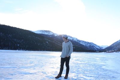 Full length of man standing in snow