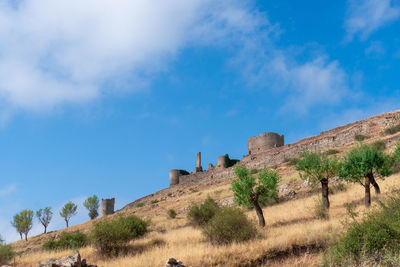 Low angle view of old ruins of a castle against sky