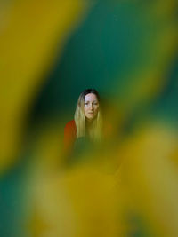 Portrait of young woman standing outdoors