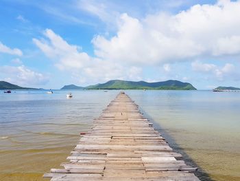 Pier over sea against sky