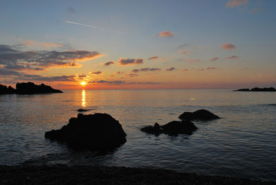 Scenic view of sea at sunset