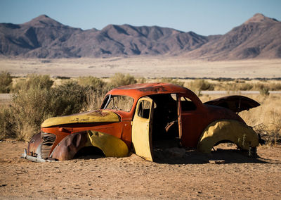 Abandoned car on desert