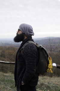 Side view of man hiking in winter