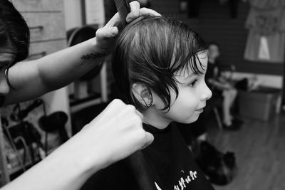 Close-up of girl getting a hair cut