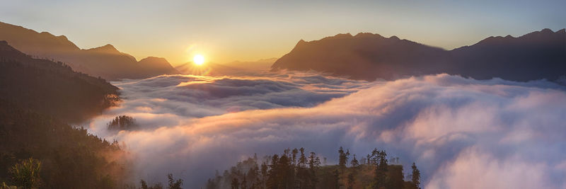 Panoramic view of mountains against sky during sunset