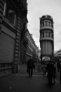 Silhouette of woman standing in city