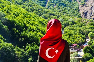 Rear view of woman wearing hijab against trees