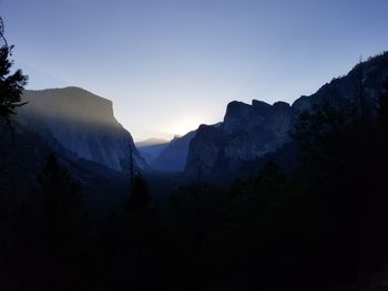 Scenic view of silhouette mountains against clear sky