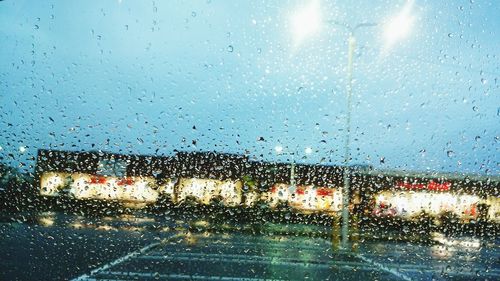 Close-up of wet glass window in rainy season