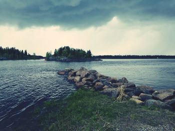 Scenic view of sea against cloudy sky