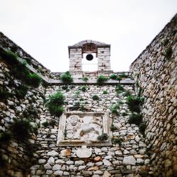 Low angle view of stone wall