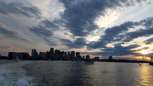 Boston silhouettes look dark as the sun sets in a late day western sky. 