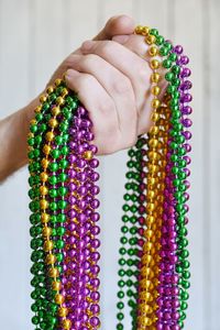 Close-up of woman hand holding multi colored candies