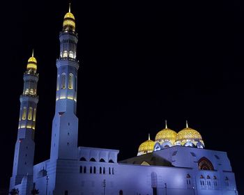 Illuminated cathedral against sky at night