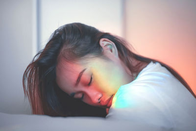 Close-up portrait of a woman lying down