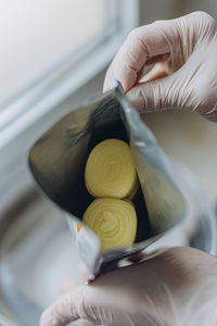 Cropped hand of woman holding coffee