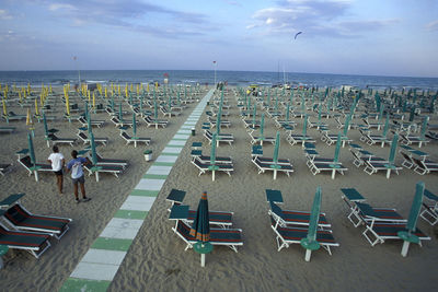 High angle view of chairs on beach