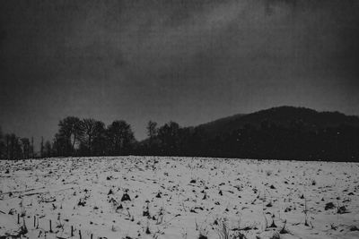 Scenic view of snow field against sky