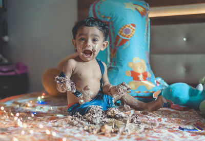 Full length of shirtless man at home