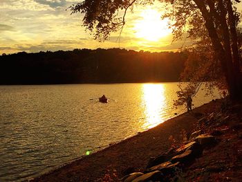 View of calm lake at sunset