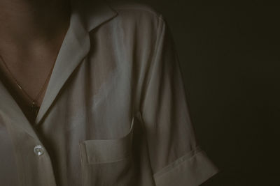 Close-up midsection of man wearing shirt