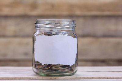 Close-up of drink in glass jar on table