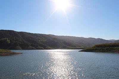 Scenic view of lake with mountains in background