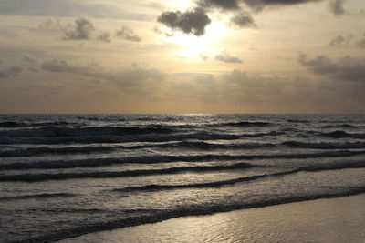 Scenic view of beach against sky during sunset
