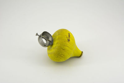 High angle view of yellow toy over white background