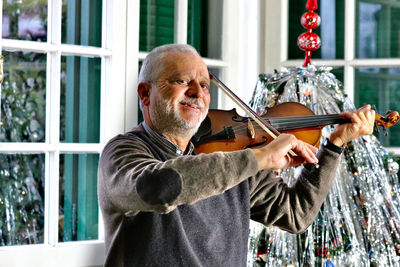 Portrait of man playing guitar