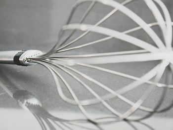 Close-up of metallic structure on table