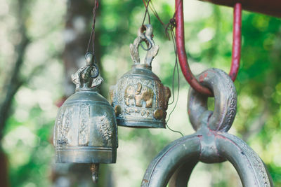 Close-up of bell hanging on metal