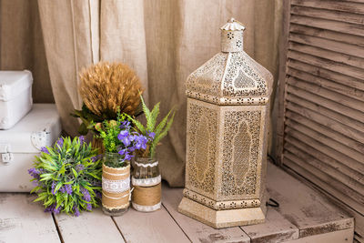 Flower vase on table at home