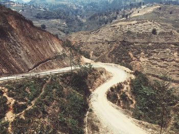 Country road leading towards mountains