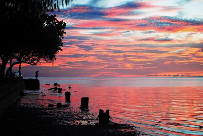 Scenic view of sea against orange sky