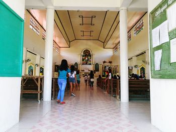 People standing in corridor