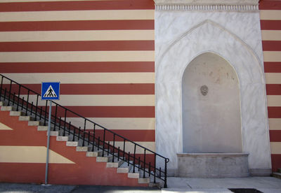 Staircase near a striped wall