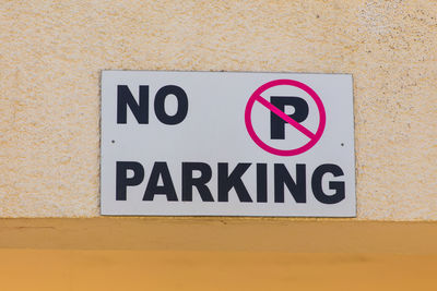 Close-up of warning sign on wall