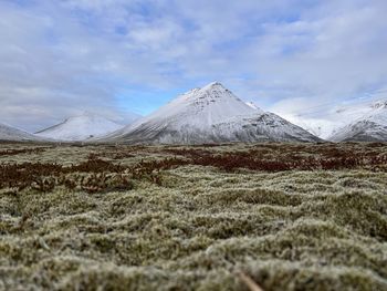 Scenic view of snowcapped mountains against sky