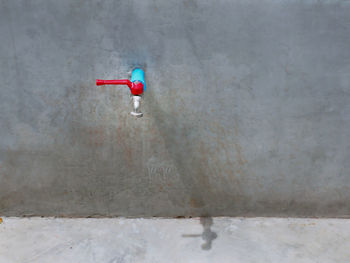 Water tap manual valve on cement wall