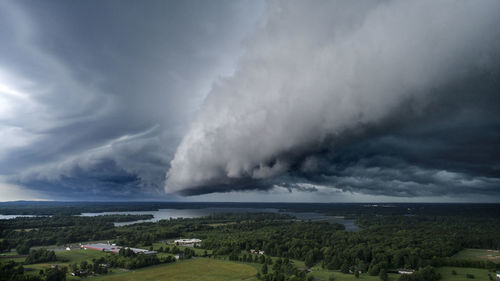 Scenic view of storm clouds over landscape