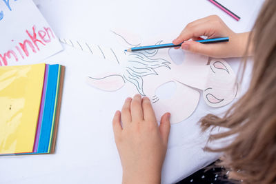 Cropped image of woman hand holding paper